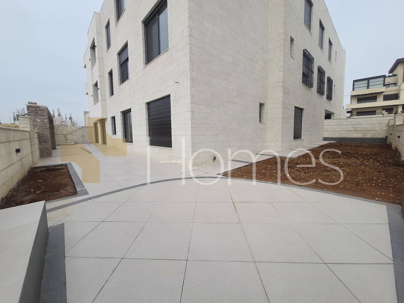 Apartment with a garden for sale in Rujm Omaish building area 220m