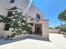 Attached villa for rent in Abdoun area with a building area of 280m