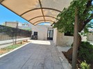 Attached villa for rent in Abdoun area with a building area of 280m