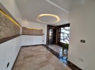 Attached villa for rent in Abdoun with a building area of 334m