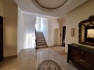 Attached villa for rent in Abdoun with a building area of 850m