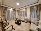 Attached villa for rent in Abdoun with a building area of 850m