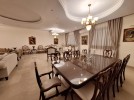 Attached villa for rent in Abdoun with a building area of 850m