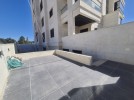 Apartment with garden for sale in Qaryet Al Nakheel, area of 200m