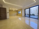 Apartment with garden for sale in Qaryet Al Nakheel, area of 200m