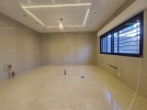 Apartment with garden for sale in Qaryet Al Nakheel, area of 200m