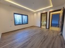 Apartment with garden for sale in Qaryet Al Nakheel, area of 200m