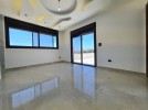 Last floor with roof for sale in Qaryet Al Nakheel total area of 240m