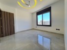 Last floor with roof for sale in Qaryet Al Nakheel total area of 240m