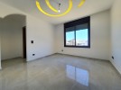 Ground floor with roof for sale in Qaryet Al Nakheel an area 200m