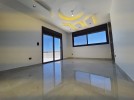 Ground floor with roof for sale in Qaryet Al Nakheel an area 200m