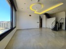 Ground floor with roof for sale in Qaryet Al Nakheel an area 200m