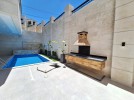 Flat floor apartment with pool and garden for sale in Abdoun 355m