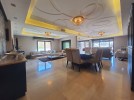 Furnished apartment with garden for sale in Rujm Omaish area of 335m