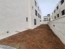 Apartment with a garden for sale in Rujm Omaish building area 220m