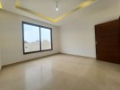 Apartment with a garden for sale in Rujm Omaish building area 220m