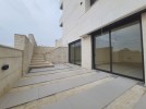 Apartment with a garden for sale in Rujm Omaish building area 220m